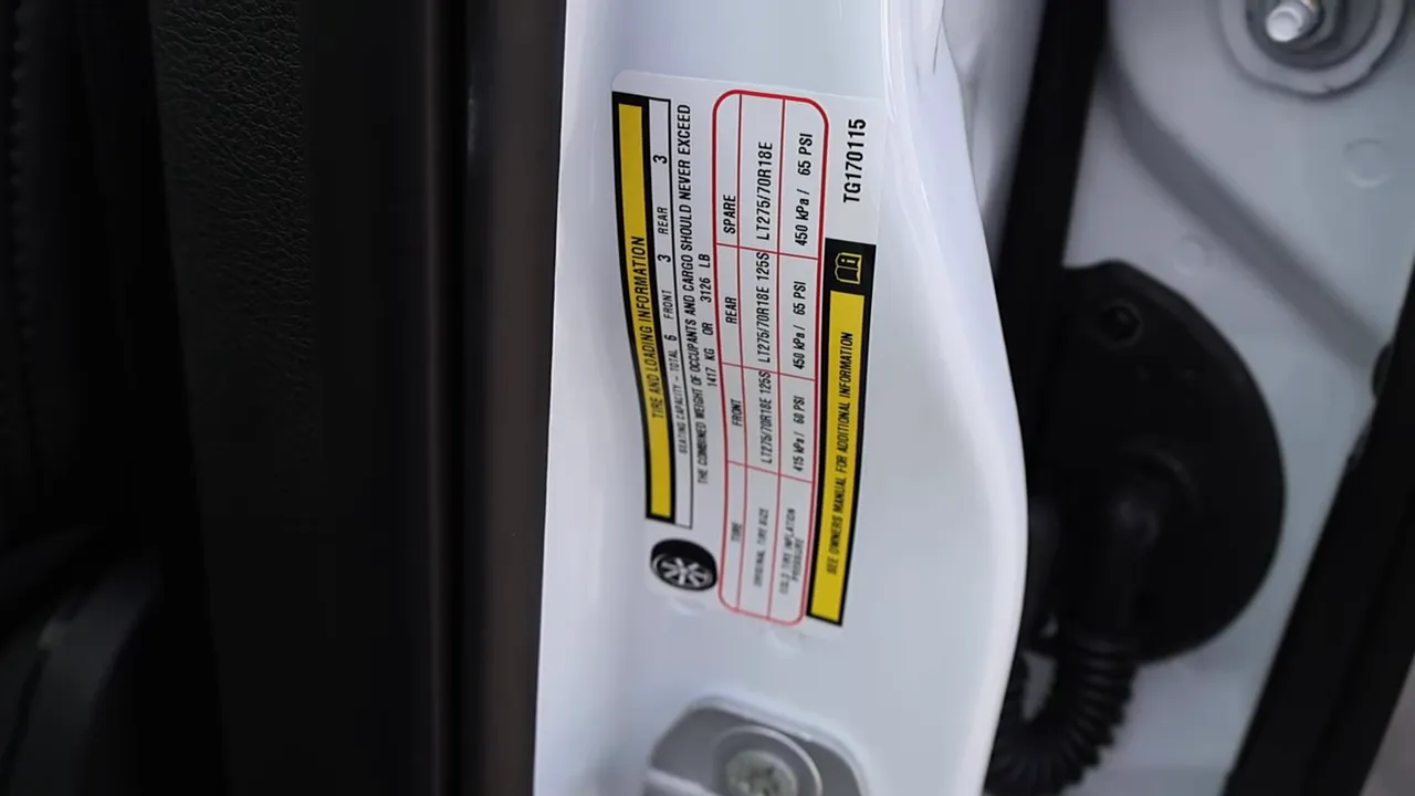 Detailed view of the Ram 2500 door placard with GVWR, tire sizes and recommended pressures