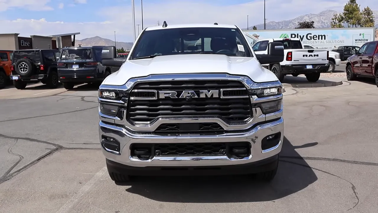 Full front view of 2026 Ram 2500 Tradesman showing RAM grille, LED headlights and chrome bumper