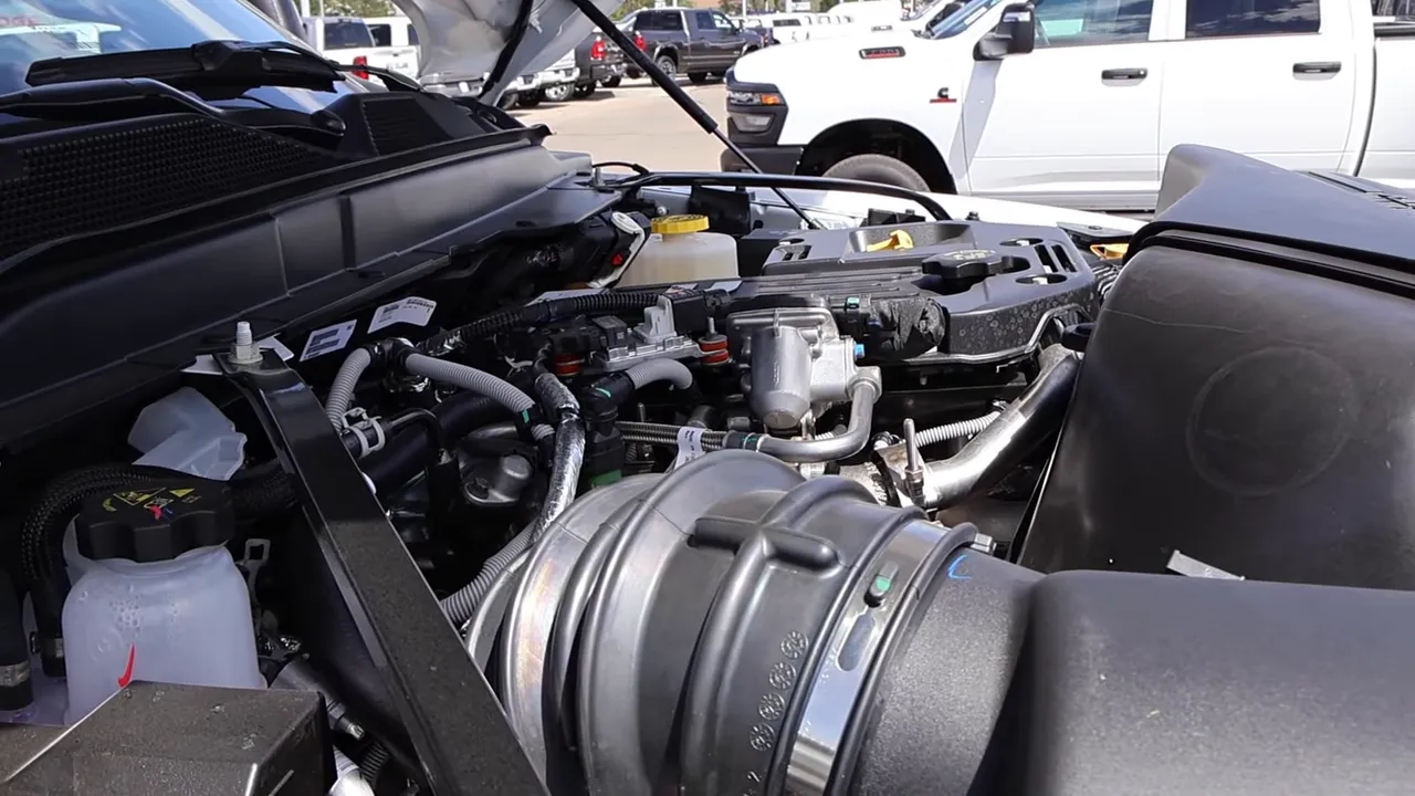 Ram 2500 engine bay showing Cummins intake, hoses and engine components with good lighting