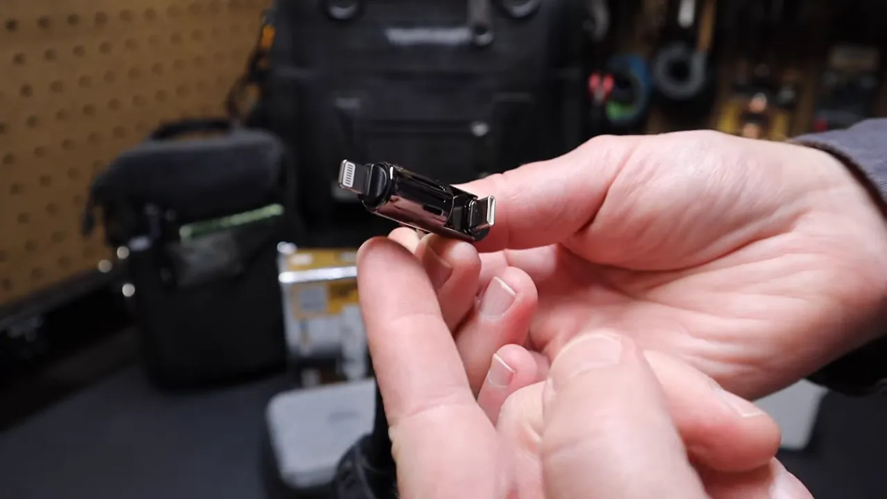 Close view of the hinge mechanism on the removable cable adapter