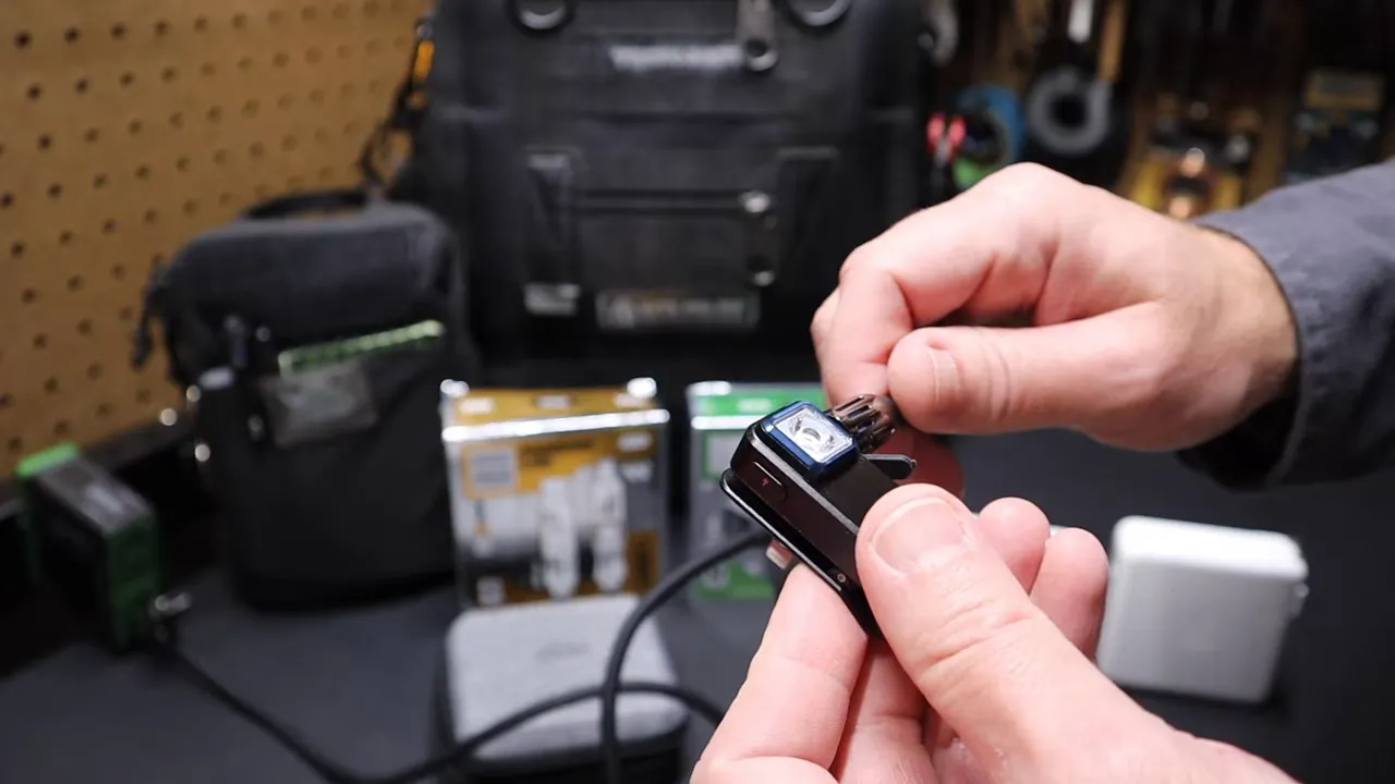Small Olight clip light charging safely from the high power MFISH charger