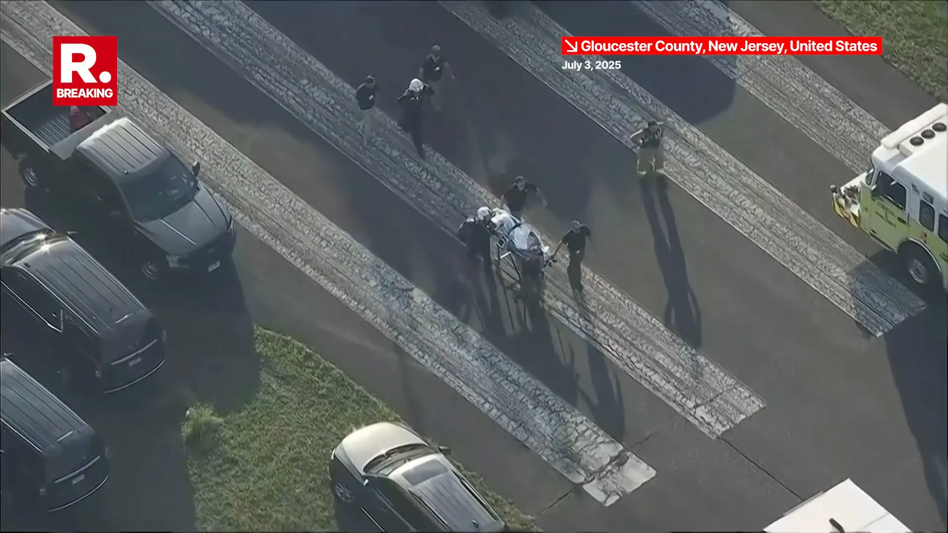 Emergency responders transporting injured on stretchers