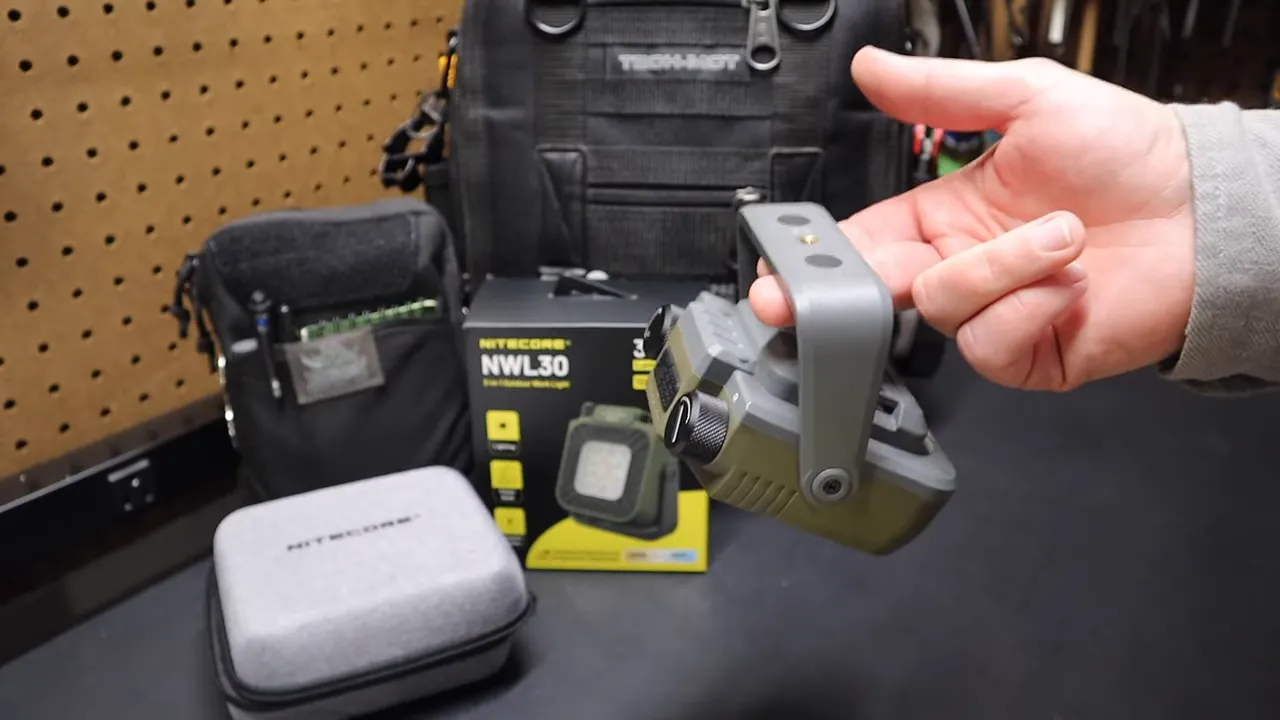 Light hanging by its handle with a paracord tether as a practical mounting example