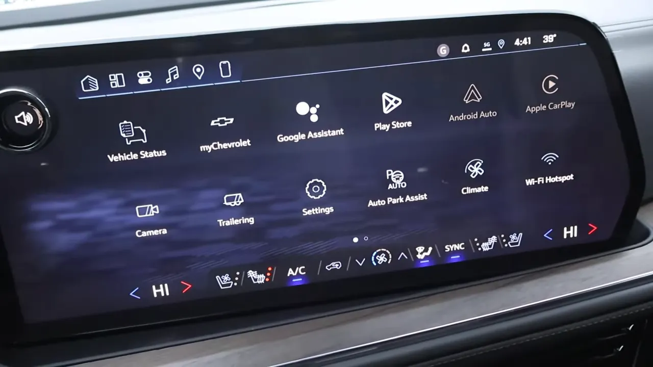 Wide view of Chevrolet infotainment home screen showing app icons like Vehicle Status, Google Assistant, Android Auto, Apple CarPlay and climate controls