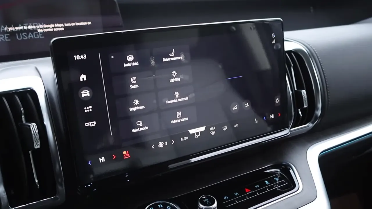 Large center infotainment touchscreen displaying a grid of touch-menu icons in the 2026 Ford Expedition interior with few physical buttons visible