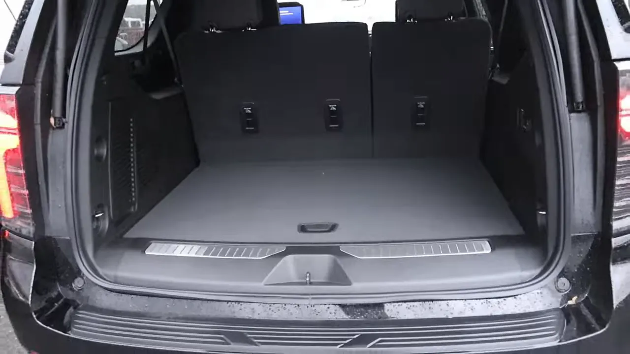 Open rear cargo area of 2026 Ford Expedition with lower tailgate down and EXPEDITION-branded cargo mat visible