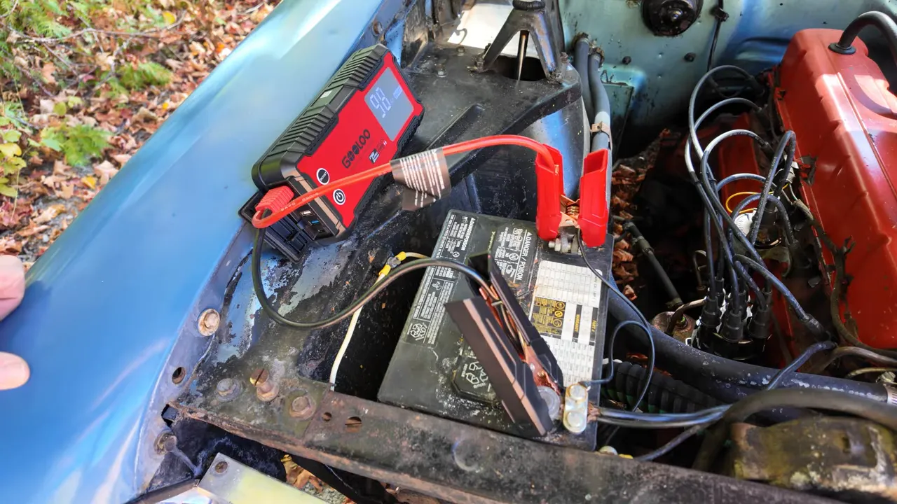 Clamps connected to battery terminals ready to start the engine
