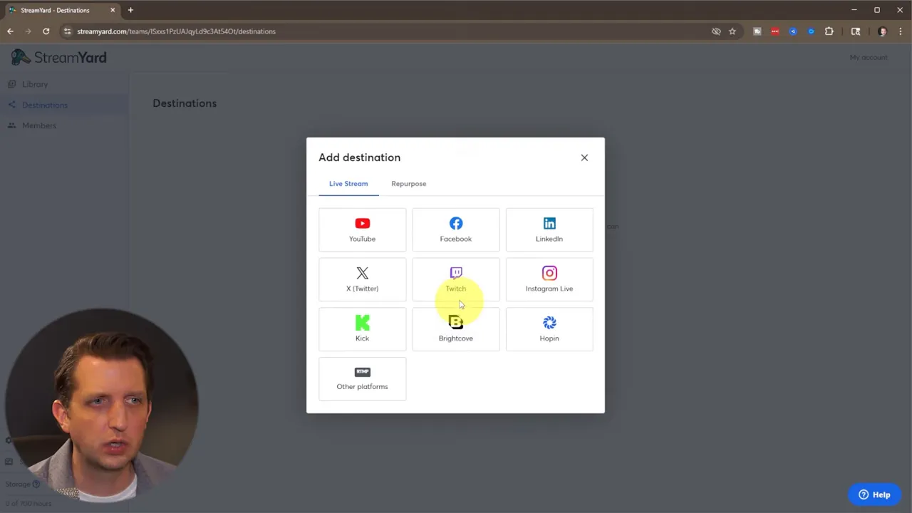 StreamYard 'Add destination' dialog with the Twitch option highlighted by the cursor, ready to connect the account