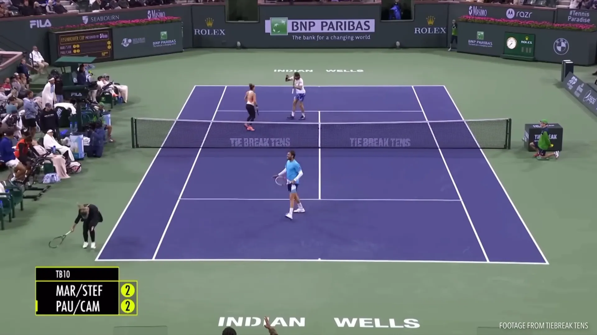 Net player focusing forward at the opponents