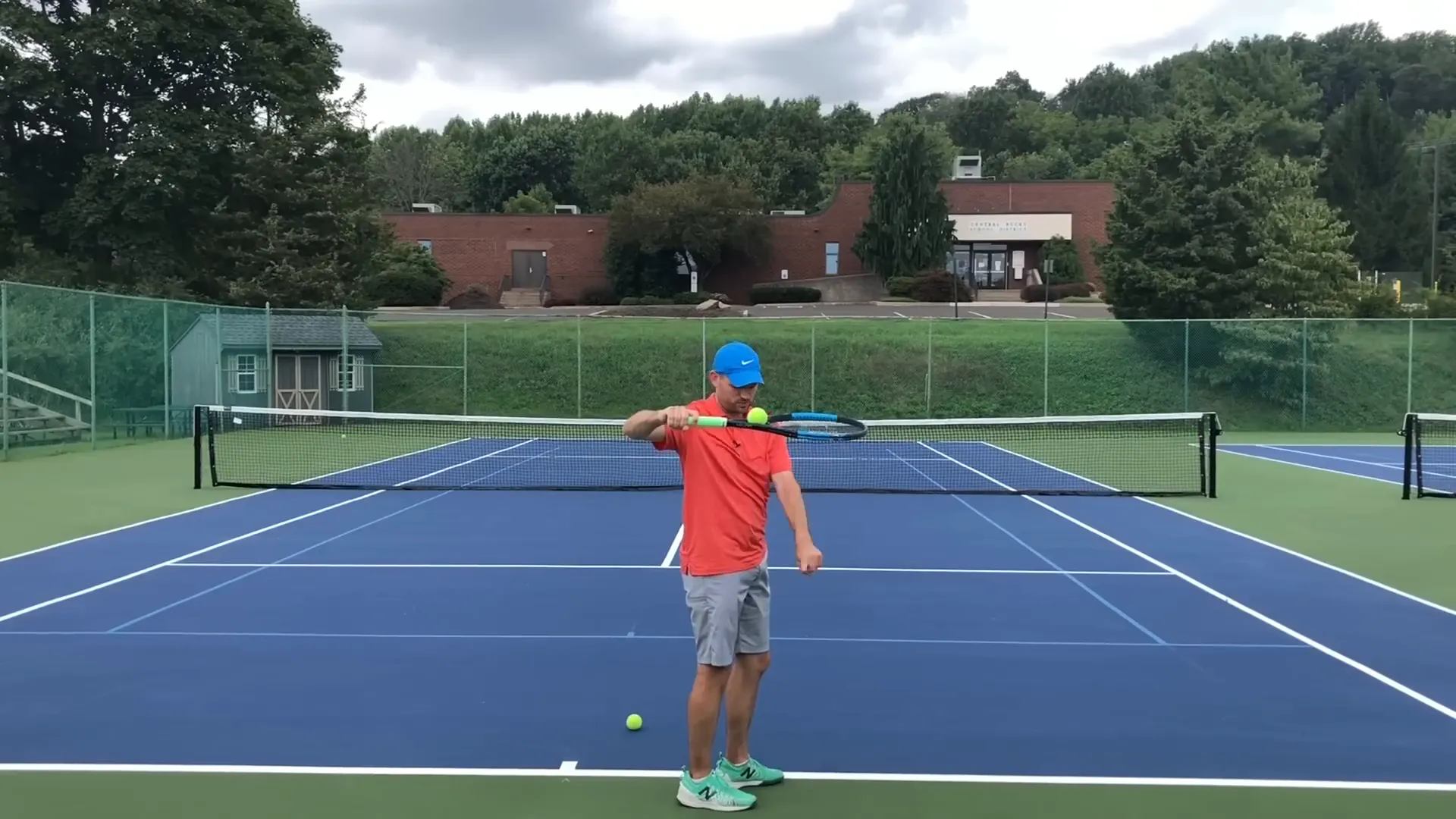 Racket strings pointing down with elbow back in backswing