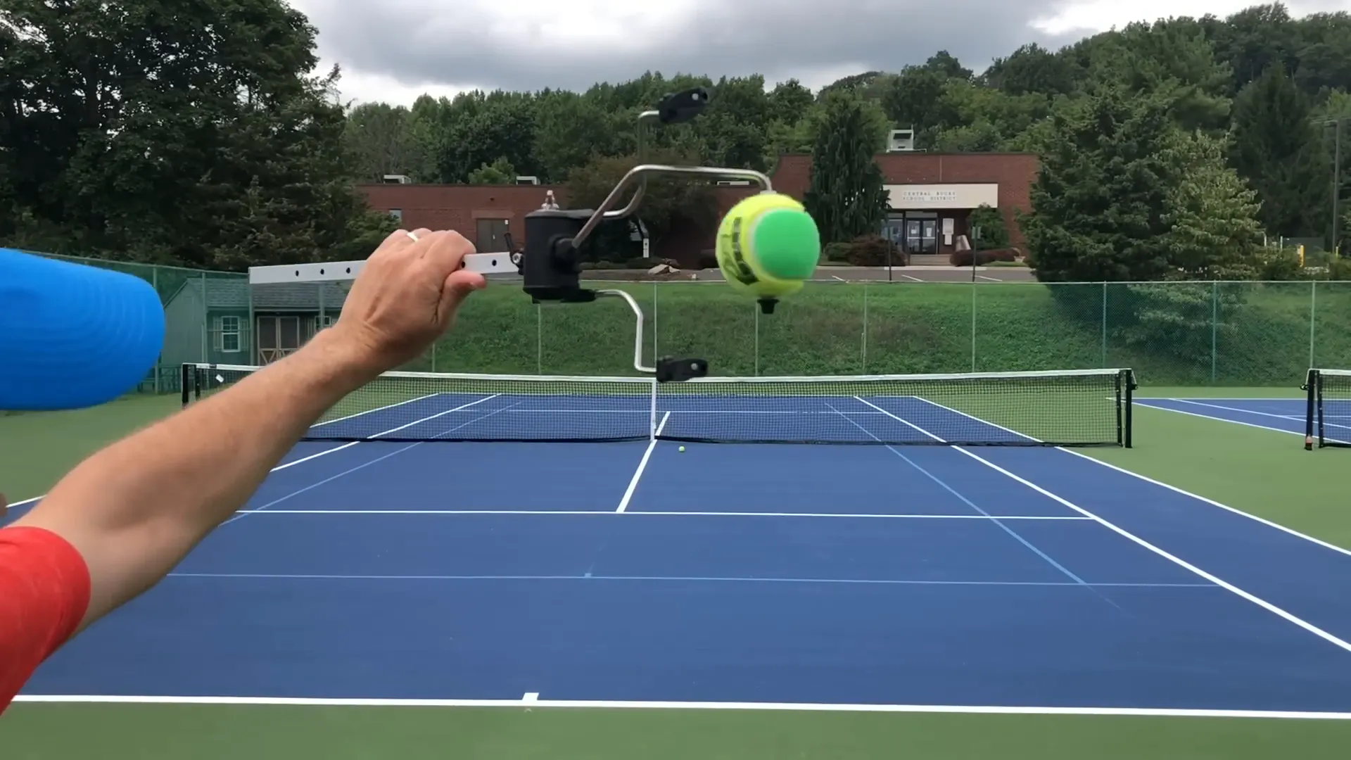 Practice sliding racket along ball edge to generate side spin