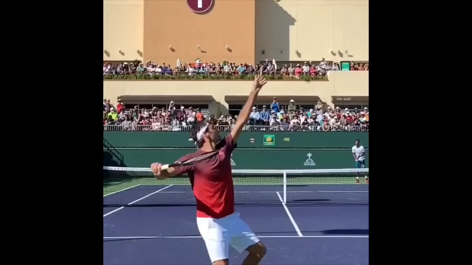 Roger Federer knocking off birthday hat with serve motion
