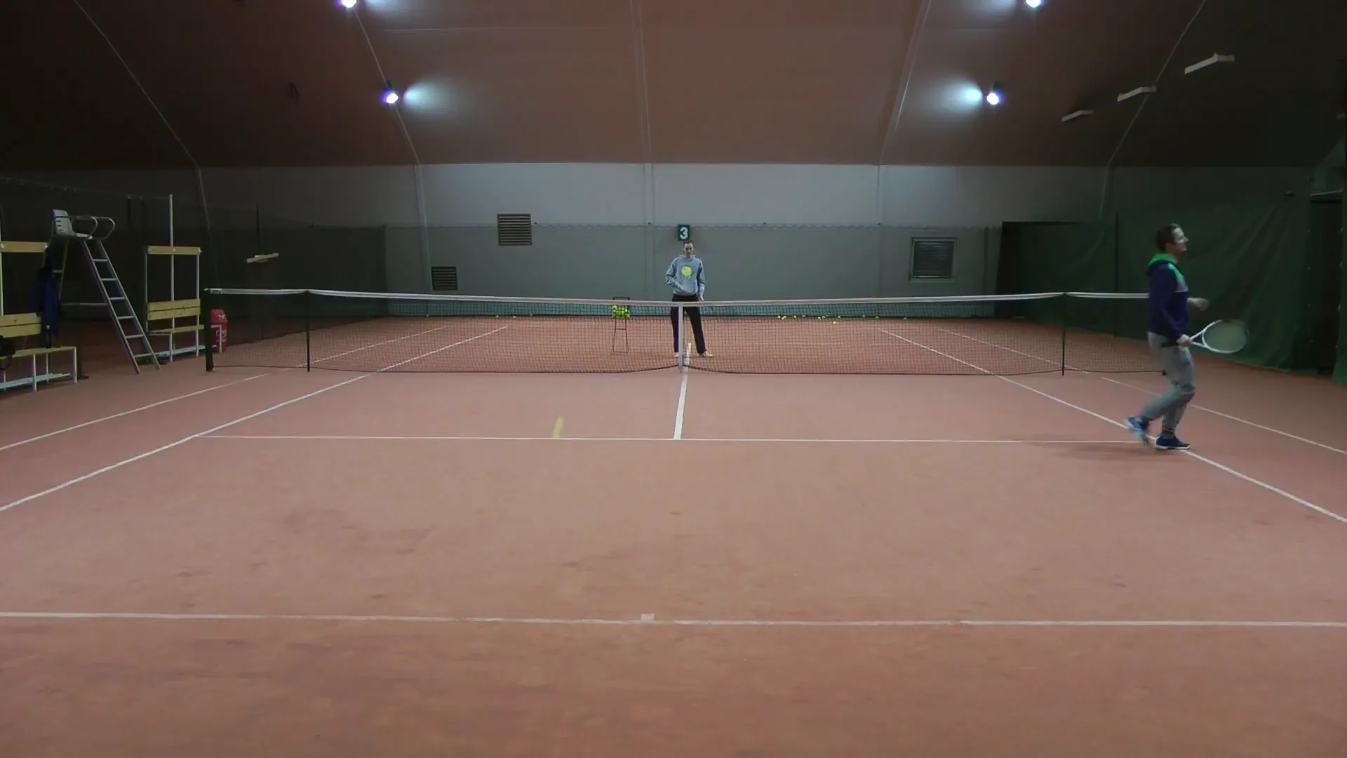 Players scrambling during a doubles point, showing unstable positions
