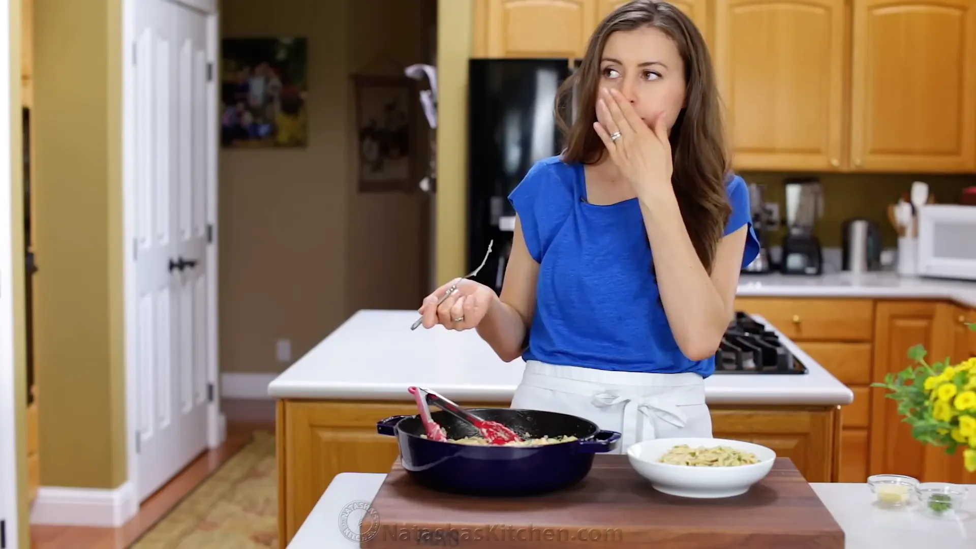 Taste testing the creamy shrimp Alfredo