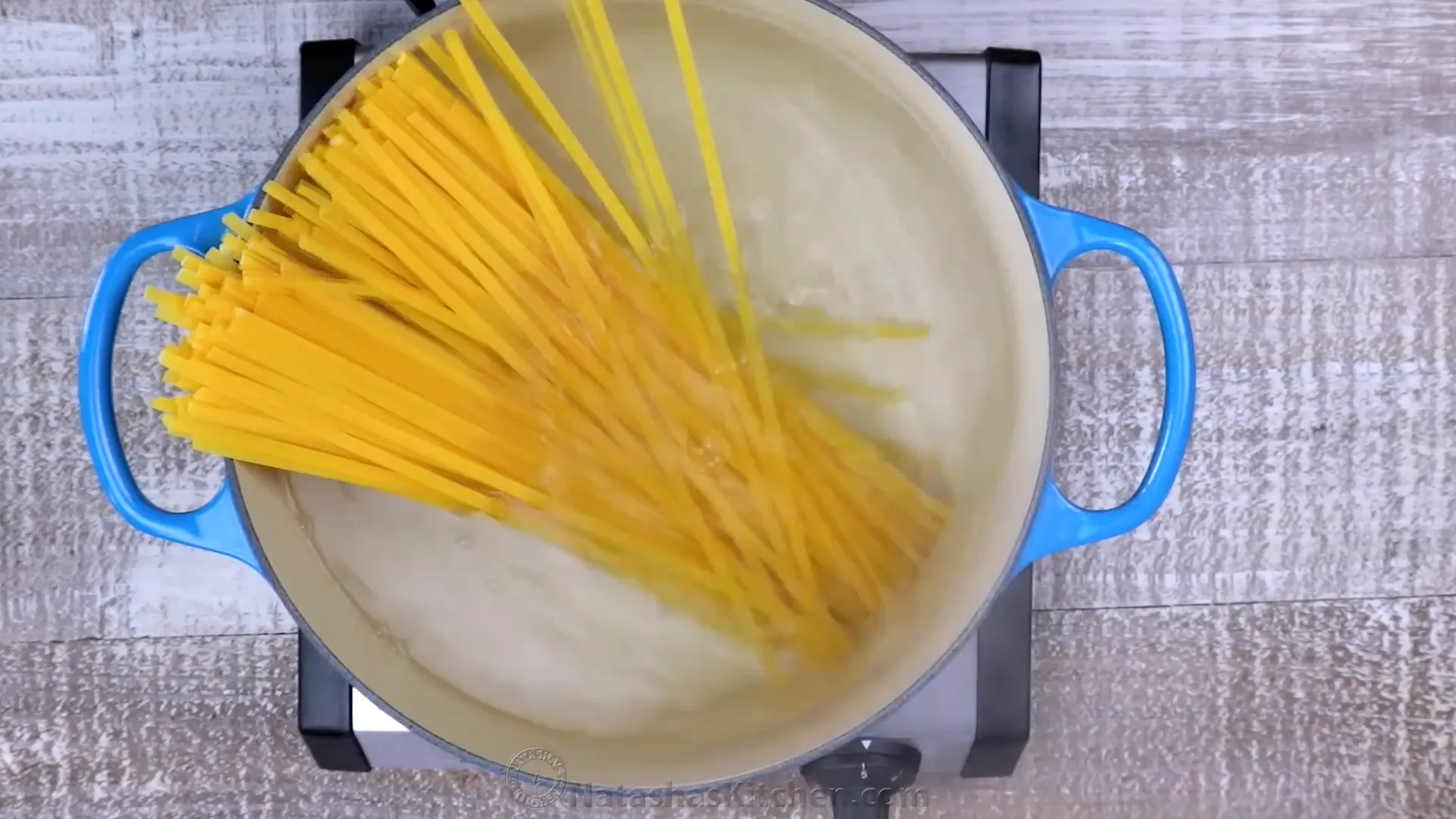 Cooking fettuccine noodles in salted water