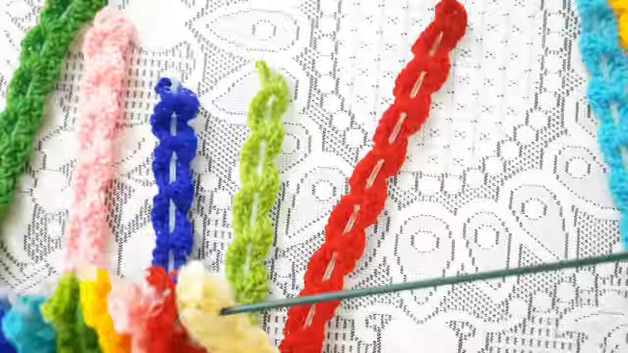 Multiple reinforced crochet strips hanging side by side from a slender horizontal metal support