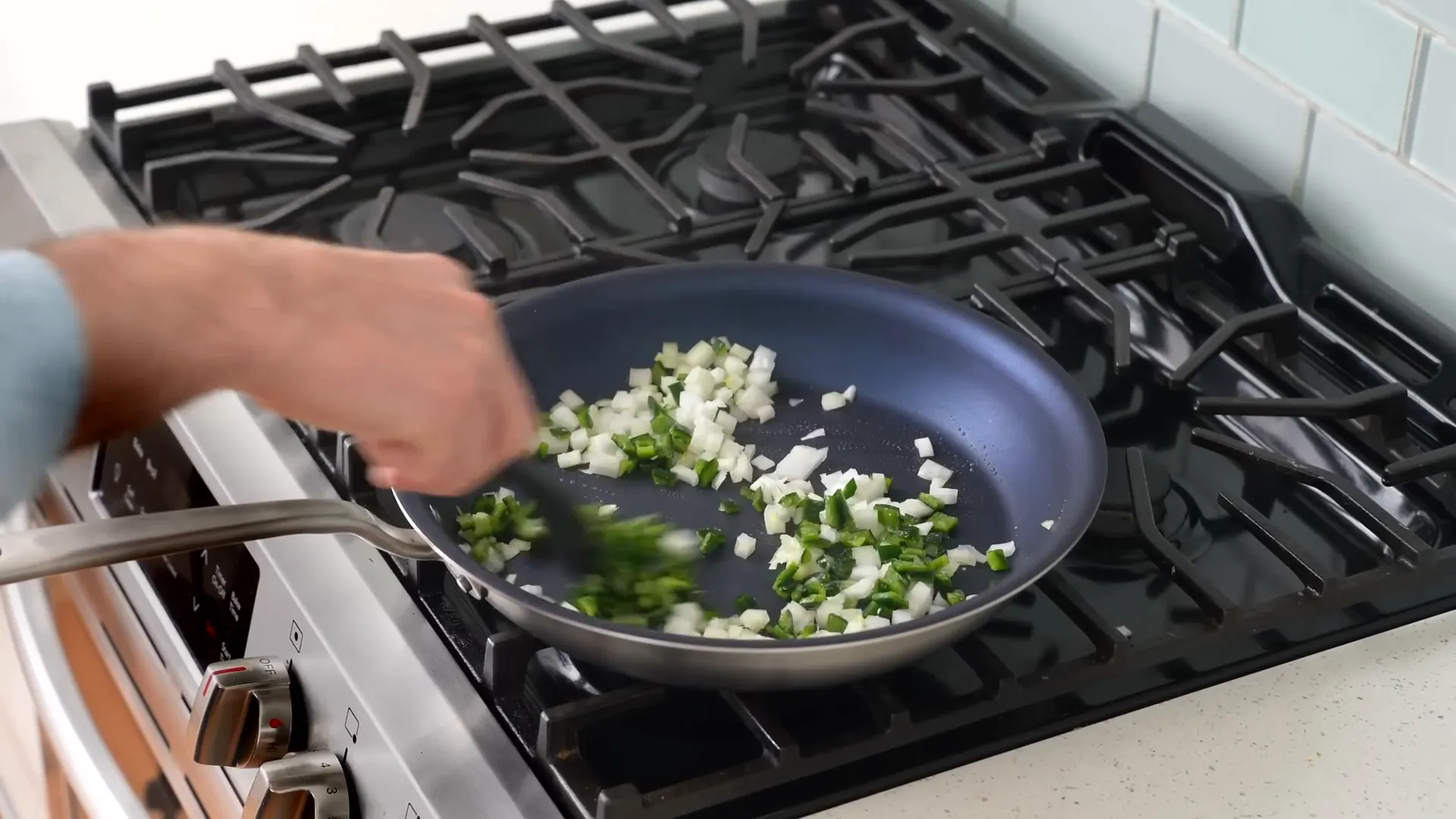 Cooking onions and poblanos