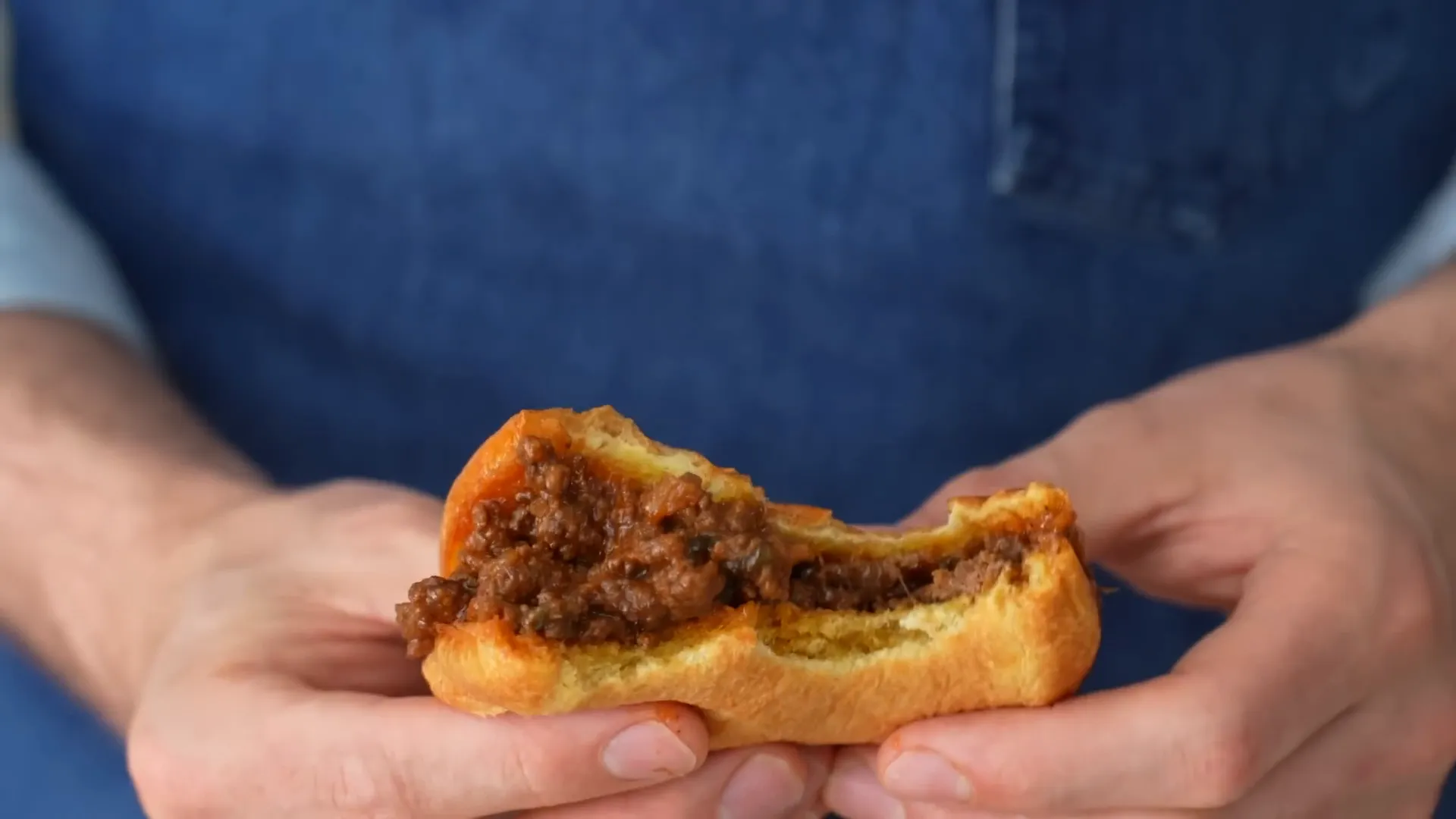 Taking a bite of the sandwich
