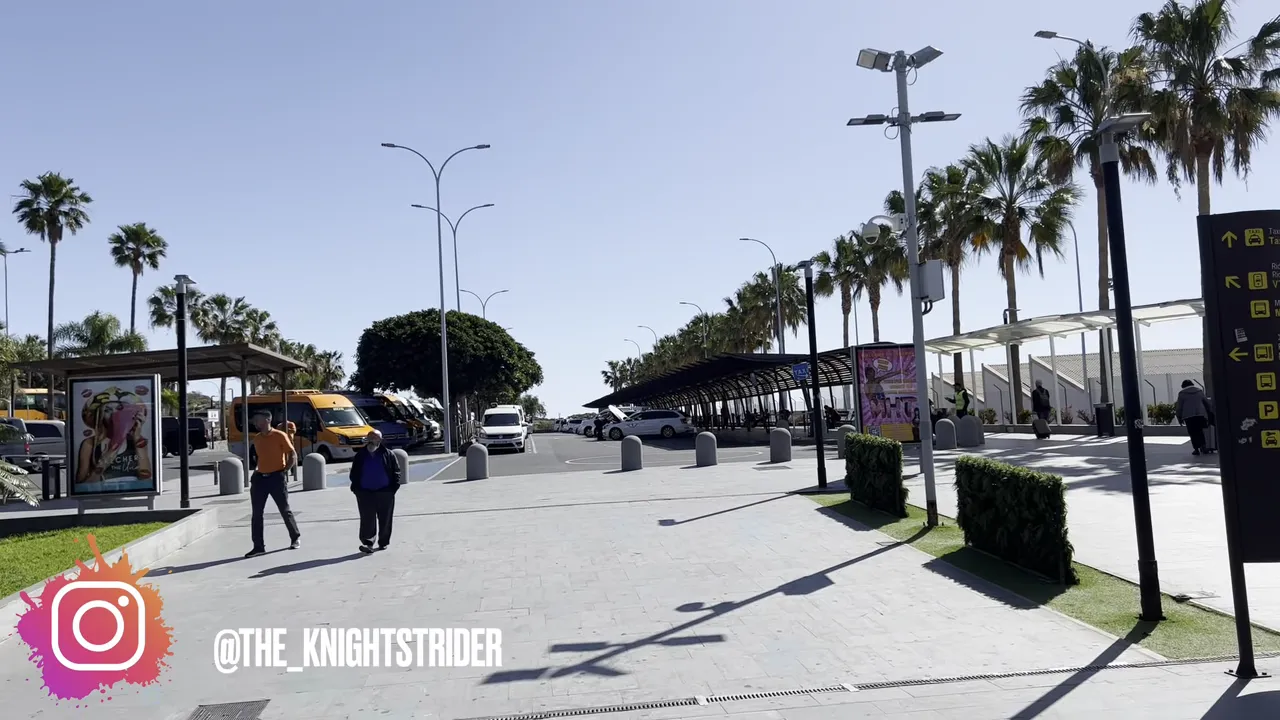 Tenerife South Airport guide - arrivals, departures, taxis, buses and car hire 3 Taxi rank and transfer bays outside Tenerife South Airport showing minibuses, taxis and covered shelters