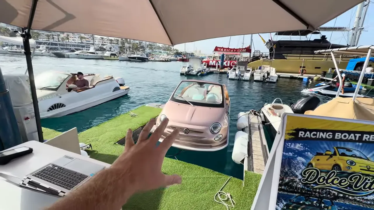 Close view of Fiat 500 Abarth excursion boat at Puerto Colón marina with dock setup