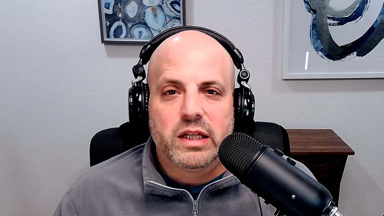 Well-lit podcast host speaking into a large microphone while explaining SBA loan choices