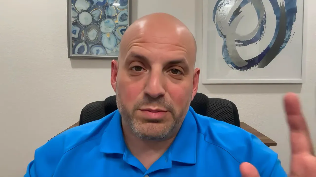 Presenter in blue polo gesturing with hand while explaining acceptable down payment sources for SBA 7(a) loans