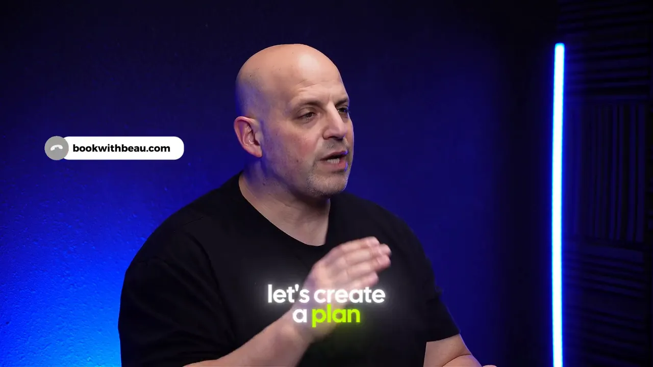 Studio shot of the speaker with on-screen text reading 'let's create a plan'.