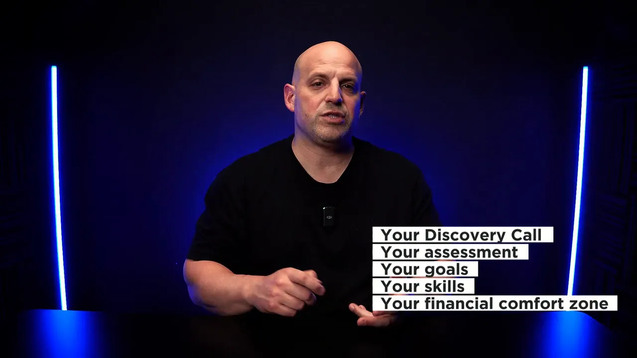 Presenter in blue-lit studio with on-screen list: 'Your Discovery Call, Your assessment, Your goals, Your skills, Your financial comfort zone'.