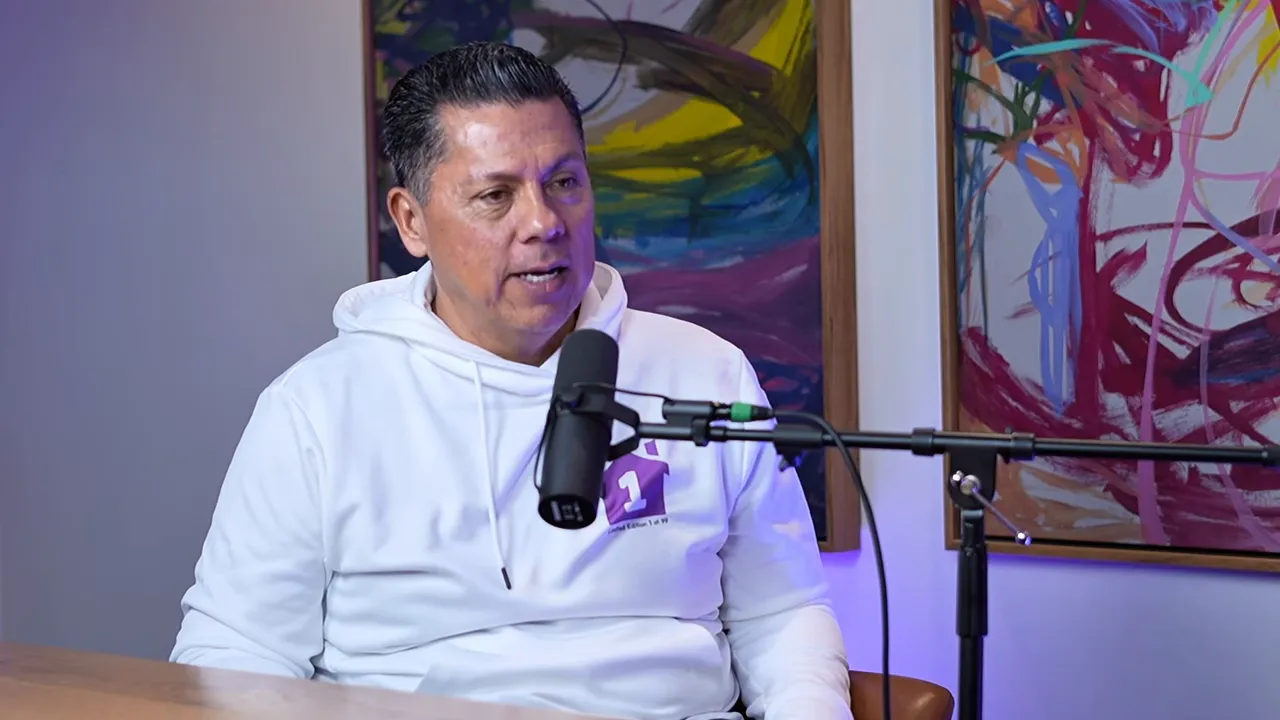 Podcast guest clearly framed and speaking into a microphone while explaining practical steps for becoming an agent-investor
