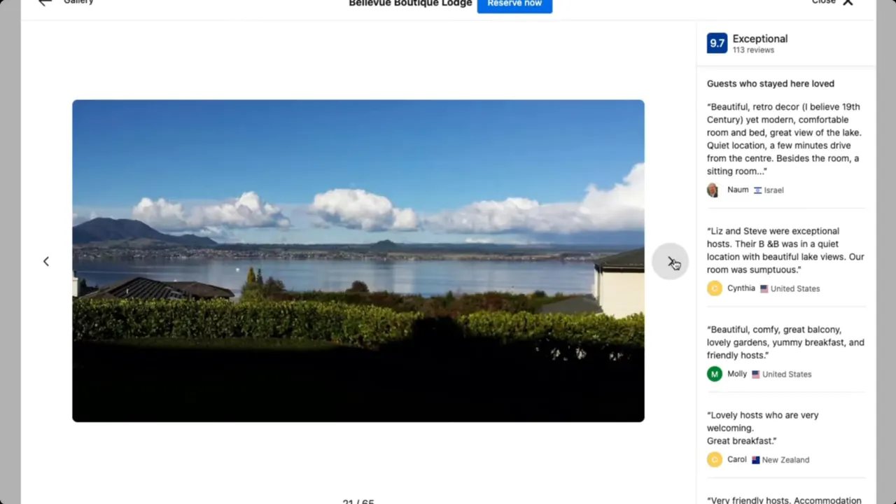 A bedroom with a large window framing Lake Taupo