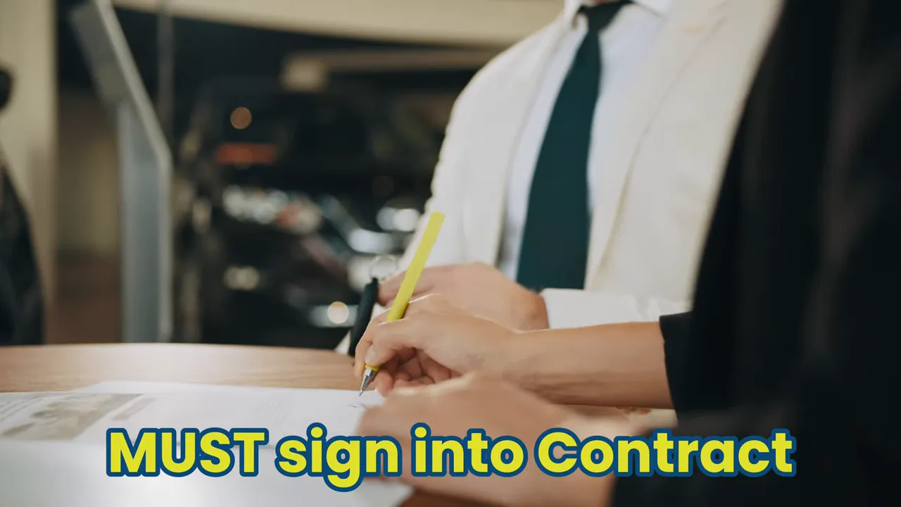 Hand signing a rental contract for 4WD hire in Australia