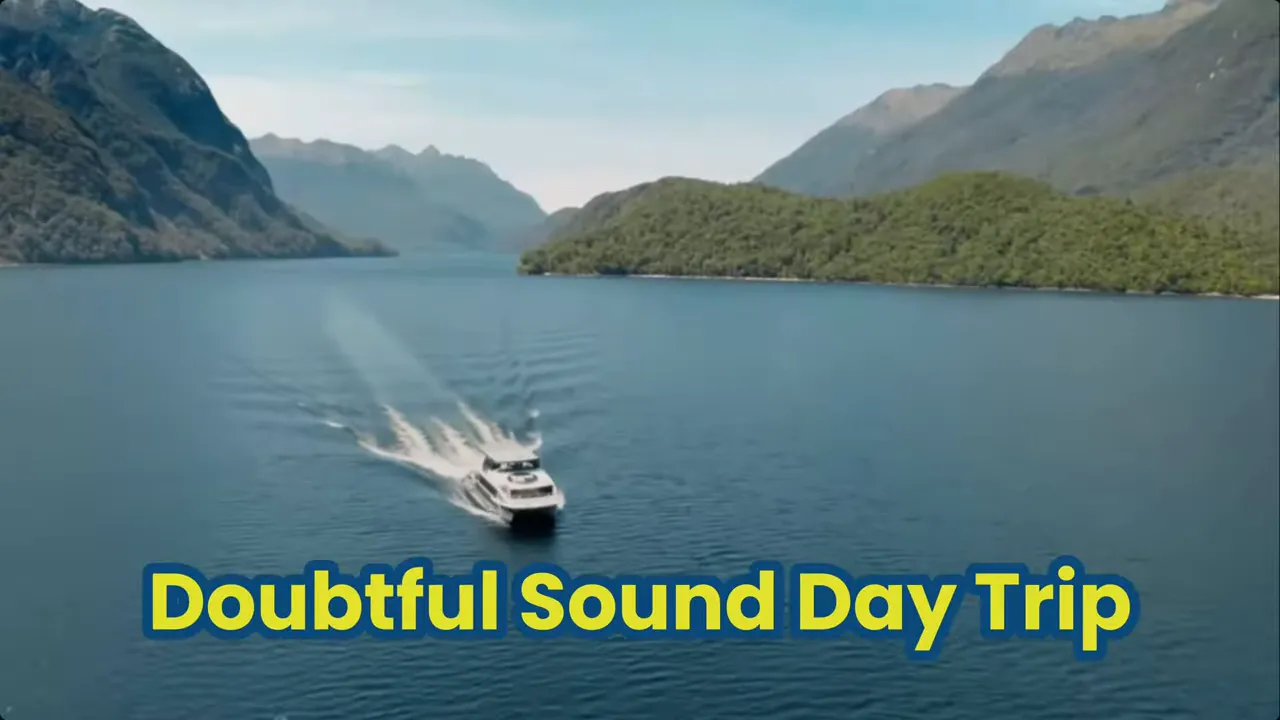 A small cruise boat crossing Doubtful Sound with forested islands and mountains and overlaid text 'Doubtful Sound Day Trip'