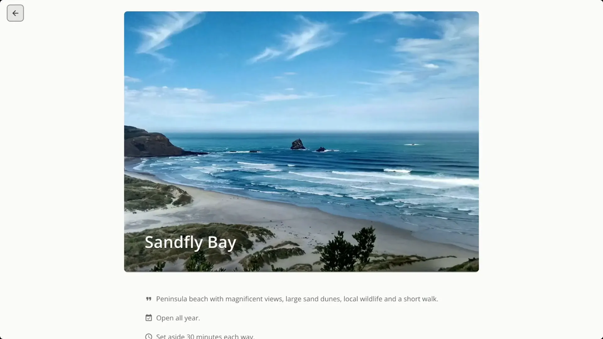 Sandfly Bay with dunes and sea views