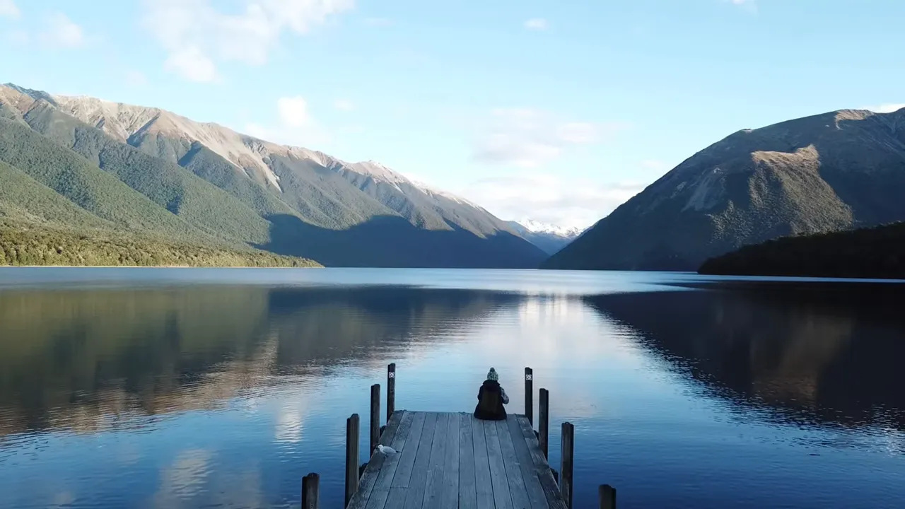 Inland drive through Nelson Lakes: forest road and alpine backdrop