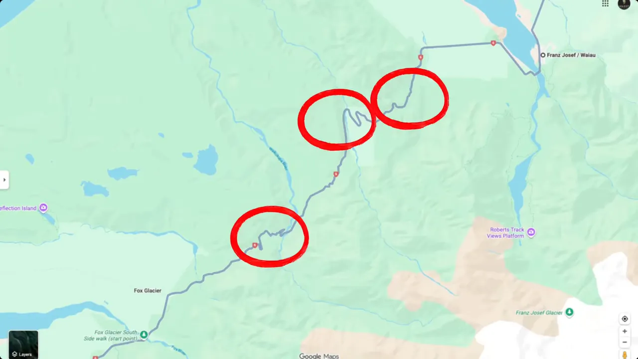 Road approaching Franz Josef and Fox with rugged hills in between