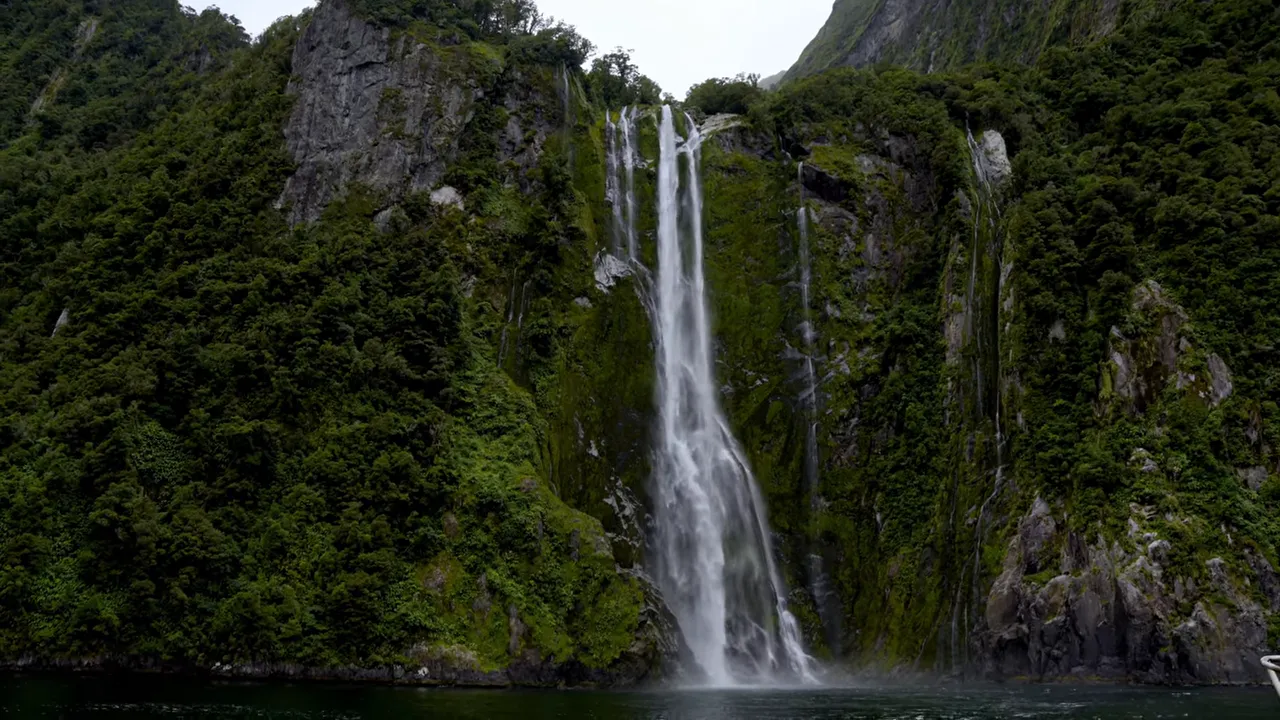 Heavy waterfall flow and rainforest vegetation that becomes spectacular in rain