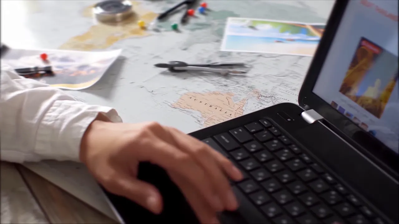 Traveler checking itinerary on a tablet while having coffee