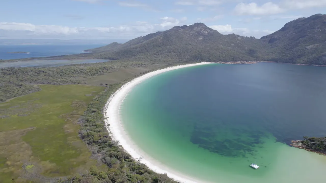 Aerial view of Wineglass Bay with white sand and turquoise water