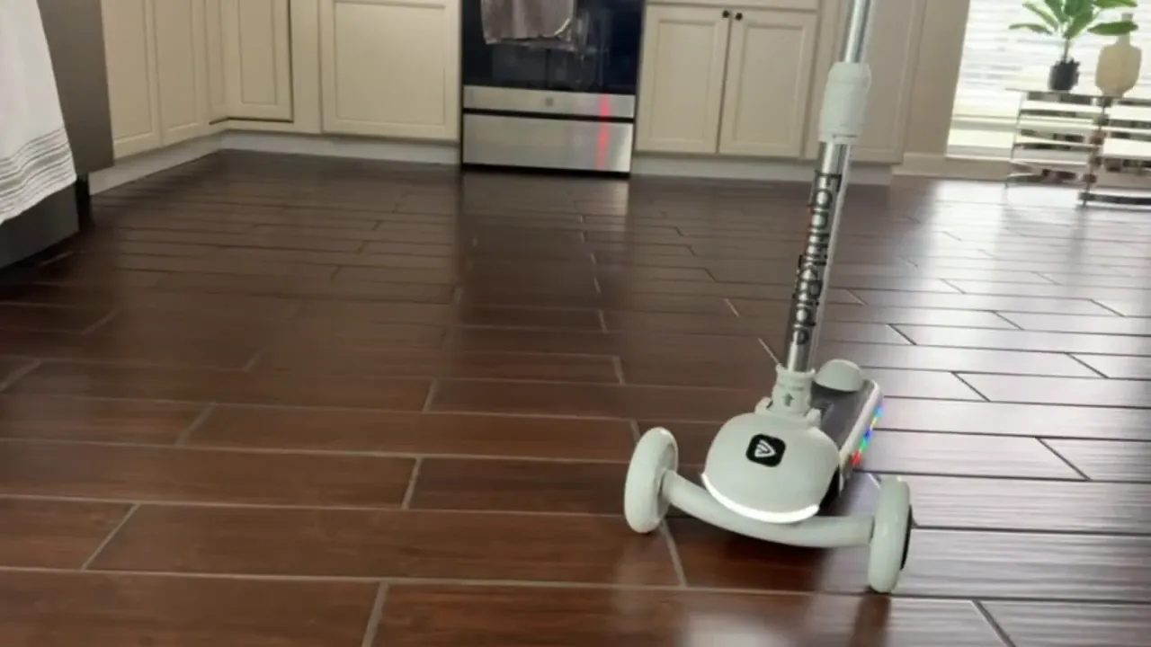 Fantic Ride K9 Pro kids three-wheel electric scooter moving indoors on flat tile floor