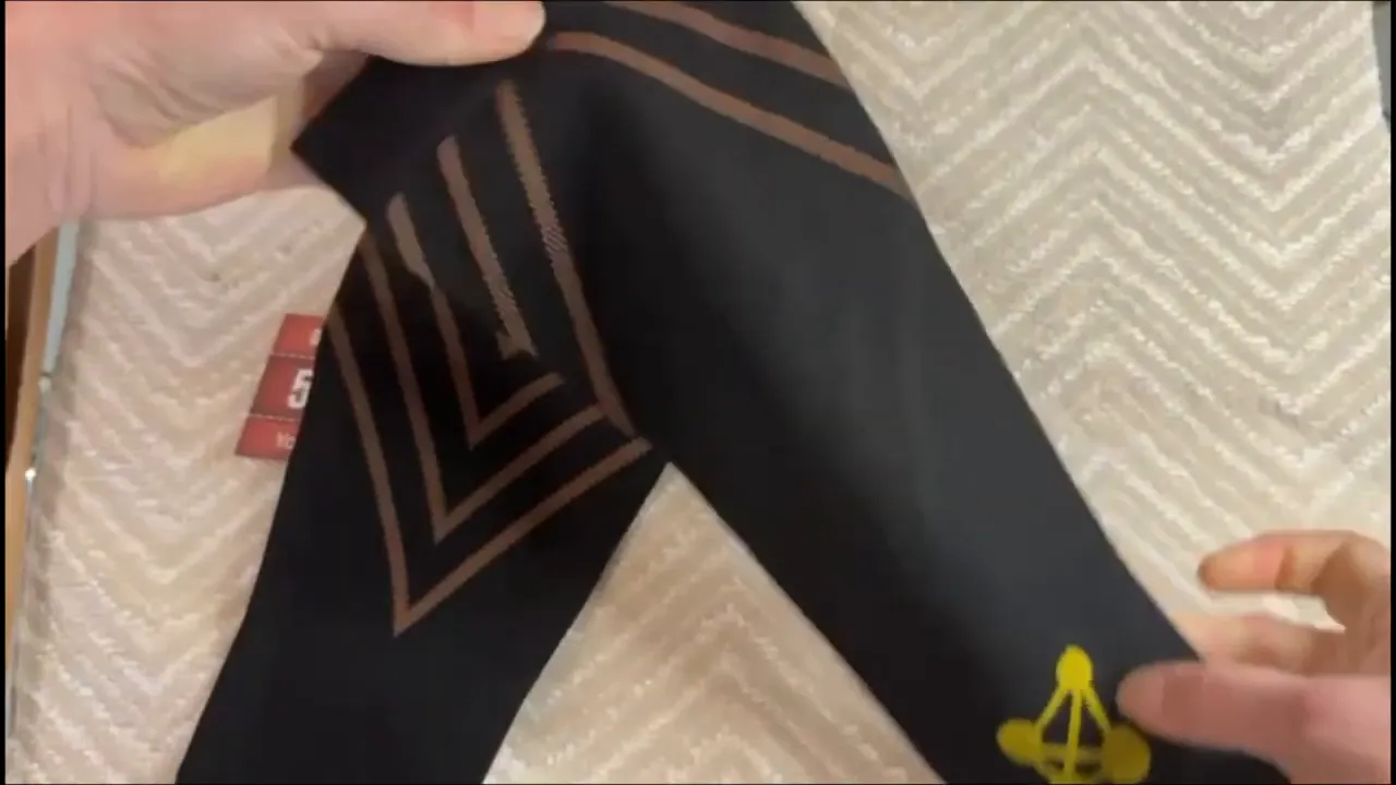 Stretching a copper compression calf sleeve to demonstrate stay-put compression fit