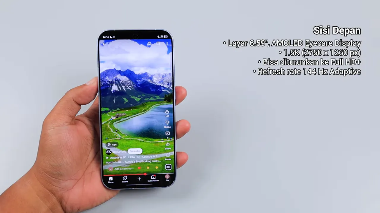 Close-up iQOO 15R menampilkan video pemandangan hijau di layar dengan teks 'Sisi Depan' dan spesifikasi layar di kanan