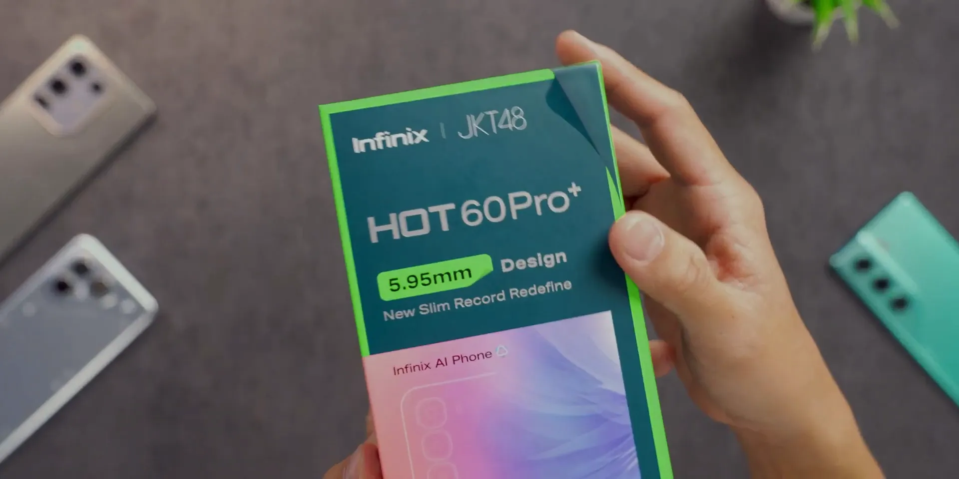 Kotak Infinix Hot 60 Pro+ dengan desain hijau khas Infinix dan kolaborasi JKT48