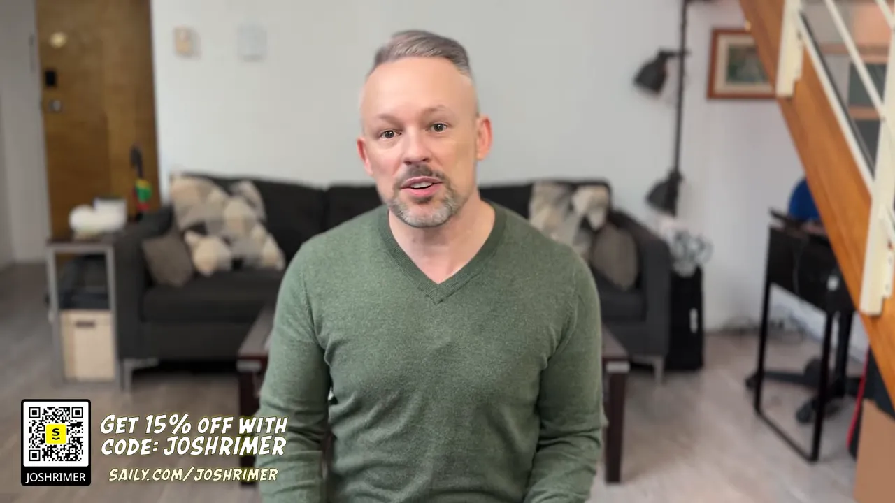 Presenter seated in a living-room setting with an on-screen promo overlay showing a QR code and text offering 15% off for a connectivity service