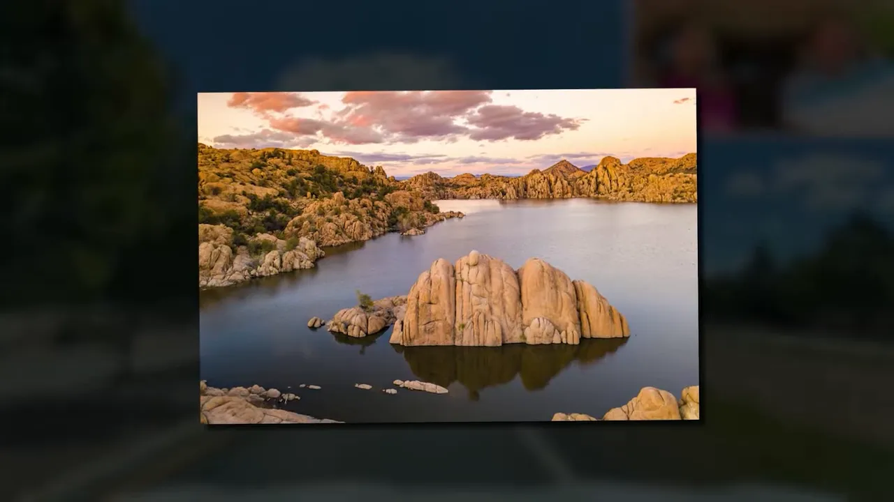 High-quality panoramic view of rocky dells and a lake with distant ridgelines and warm evening light near Prescott Valley.