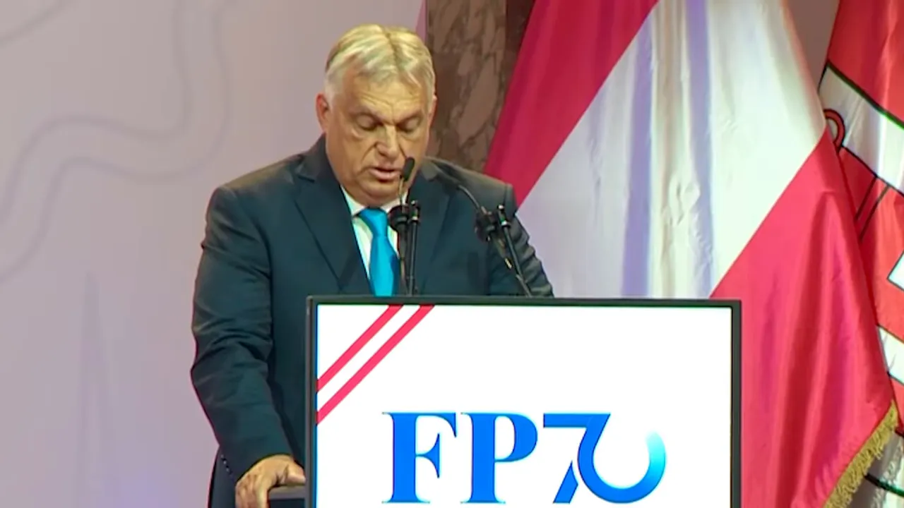 Viktor Orbán speaking at an FPÖ podium with Austrian flags behind him
