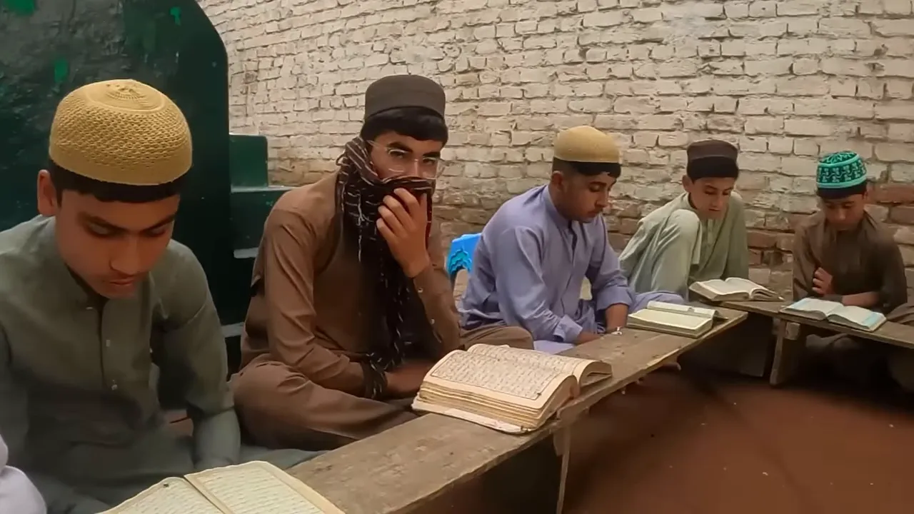 People seated reading religious texts indoors