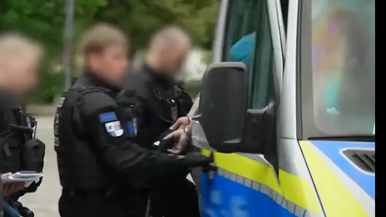 Police officer near a van during a political event