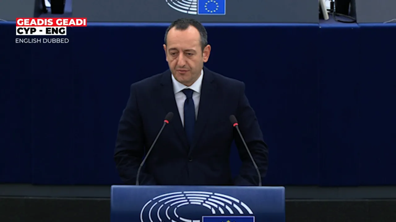 Geadis Geadi speaking at the European Parliament podium about Syria's geopolitical realities