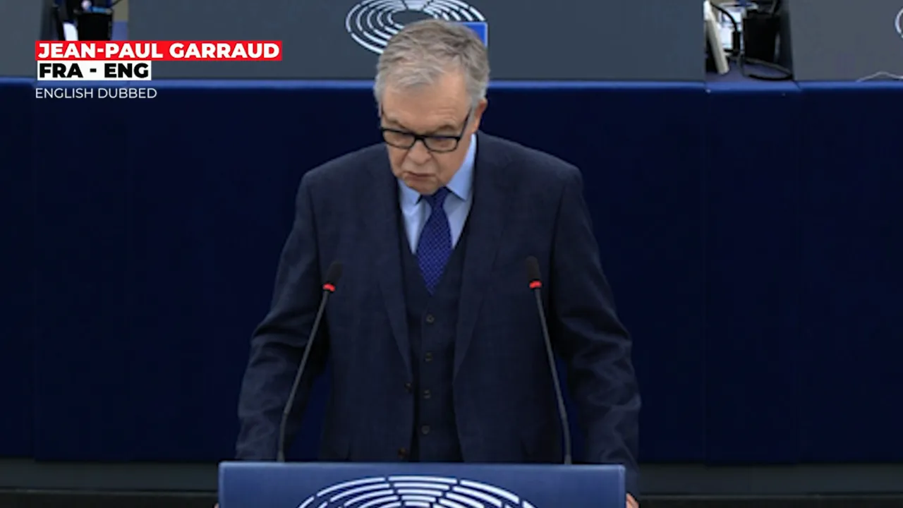 Close-up of a speaker at the lectern delivering remarks in the parliamentary chamber