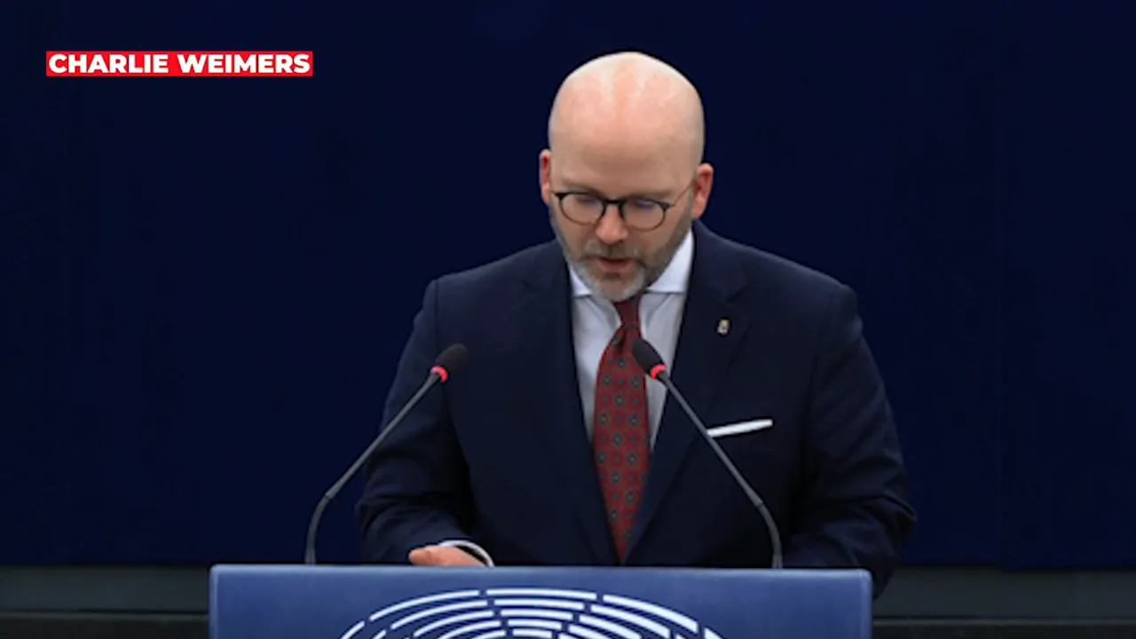 Member of a parliamentary chamber speaking at a podium, medium shot